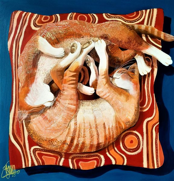 Two cats entwined on a cushion