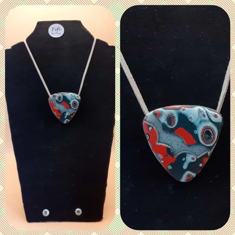 Grey, red and black triangular pendant