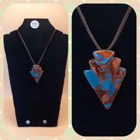 Blue and bronze triangular pendant