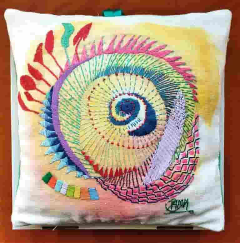 Hand embroidery on linen and velvet cushion filled with goose down. Shipped in presentation box
