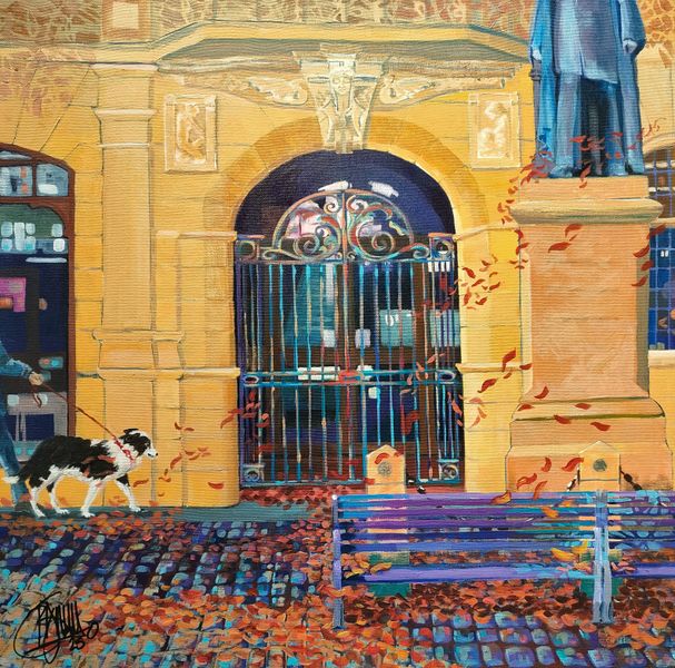 The beautiful entrance to Skipton library in autumn with collie dog