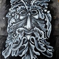 The face of Cerenus, the green man. Painted on slate.