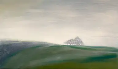 A moorland copse of trees disappearing into the mist