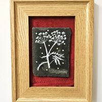 Slate painting of cow parsley with crystals on red fabric. Framed in oak.
