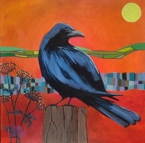 A black crow sitting on a fence post - red