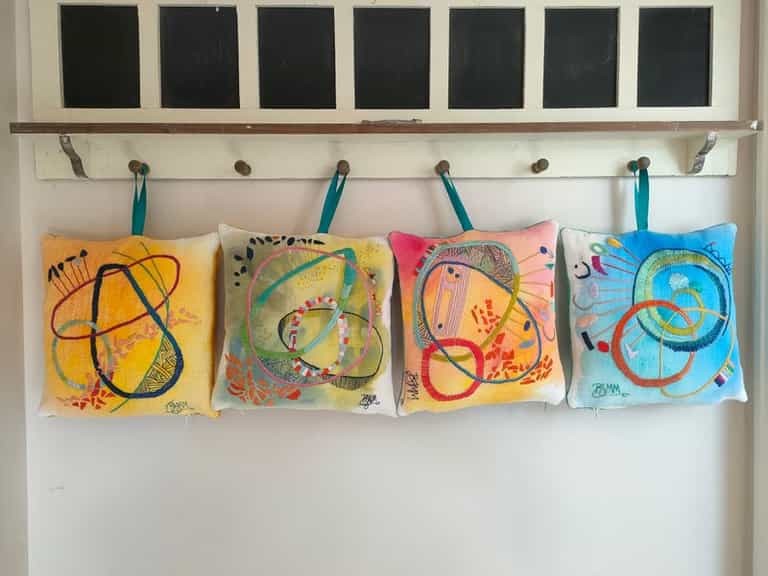 Hand embroidered art cushions