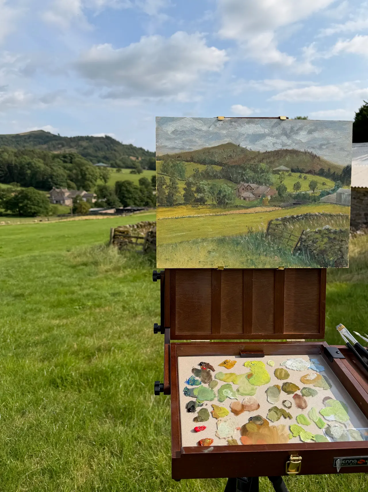Plein-air oil painting setup with easel overlooking the Yorkshire Dales landscape as Jonathan Little paints directly from Life.