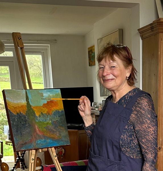 Joy Bowhay at her studio painting