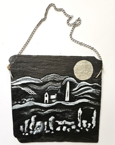 A stone wall, a mill and a silver moon on slate